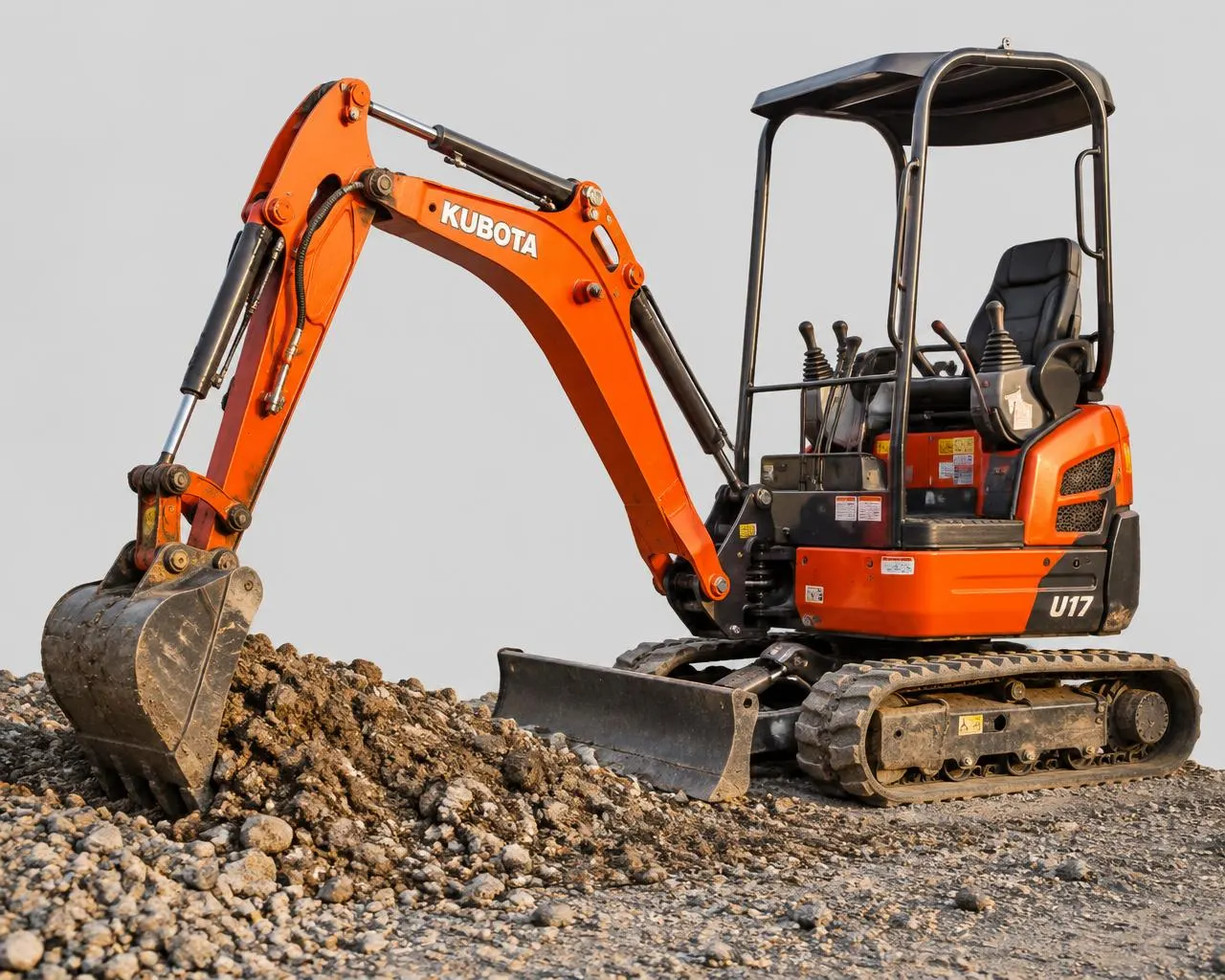 Compact excavator moving gravel on a Marlborough, CT property